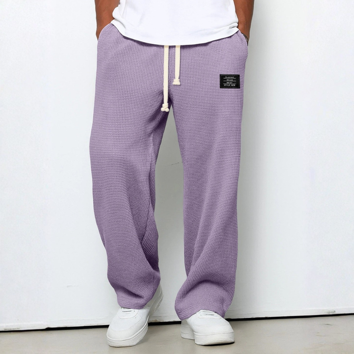 Versatile men's comfort trousers, crafted from waffle knit fabric, great for home or casual outings.