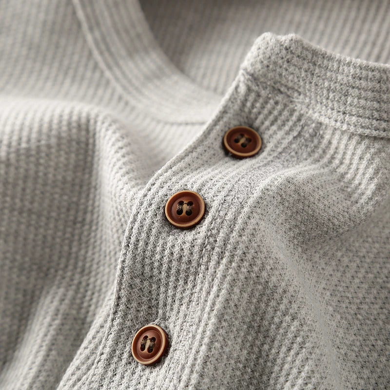 Modern men's crew neck waffle knit long sleeve shirt, a stylish piece great for versatile layering.