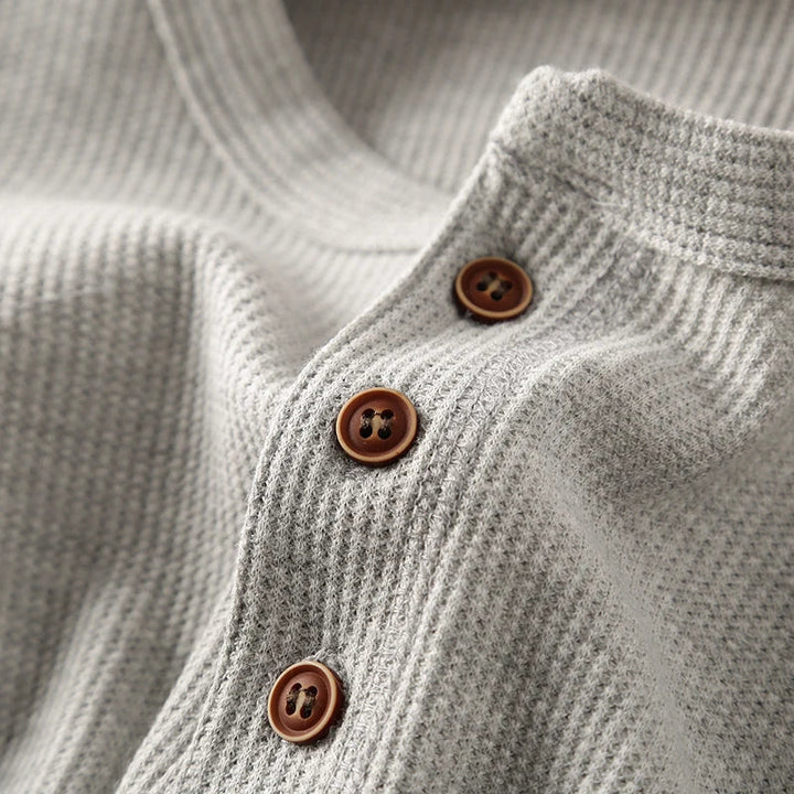 Modern men's crew neck waffle knit long sleeve shirt, a stylish piece great for versatile layering.