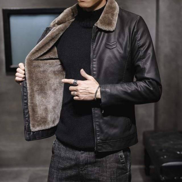Casual mens outerwear: black faux leather winter coat with warm fur interior for cold weather