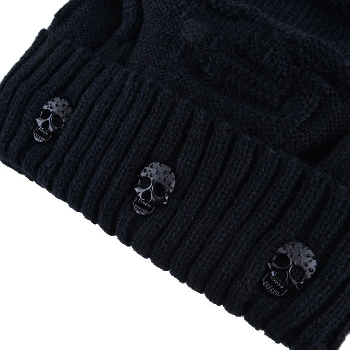 Knit men's skull cap beanie, a warm winter accessory. Metallic accents add an edgy, modern touch.