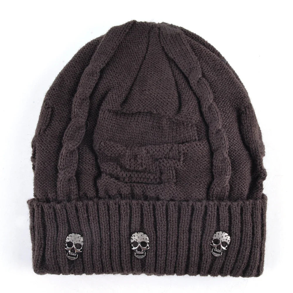 Stylish men's winter hat: a warm knit skull cap beanie with distinctive metallic accents. Edgy men's accessory.