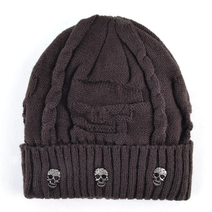 Stylish men's winter hat: a warm knit skull cap beanie with distinctive metallic accents. Edgy men's accessory.