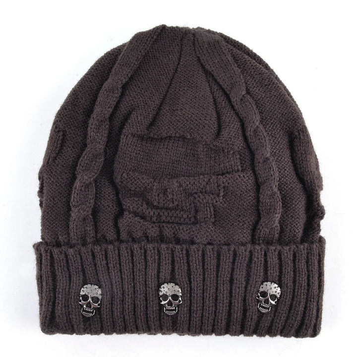Stylish men's winter hat: a warm knit skull cap beanie with distinctive metallic accents. Edgy men's accessory.