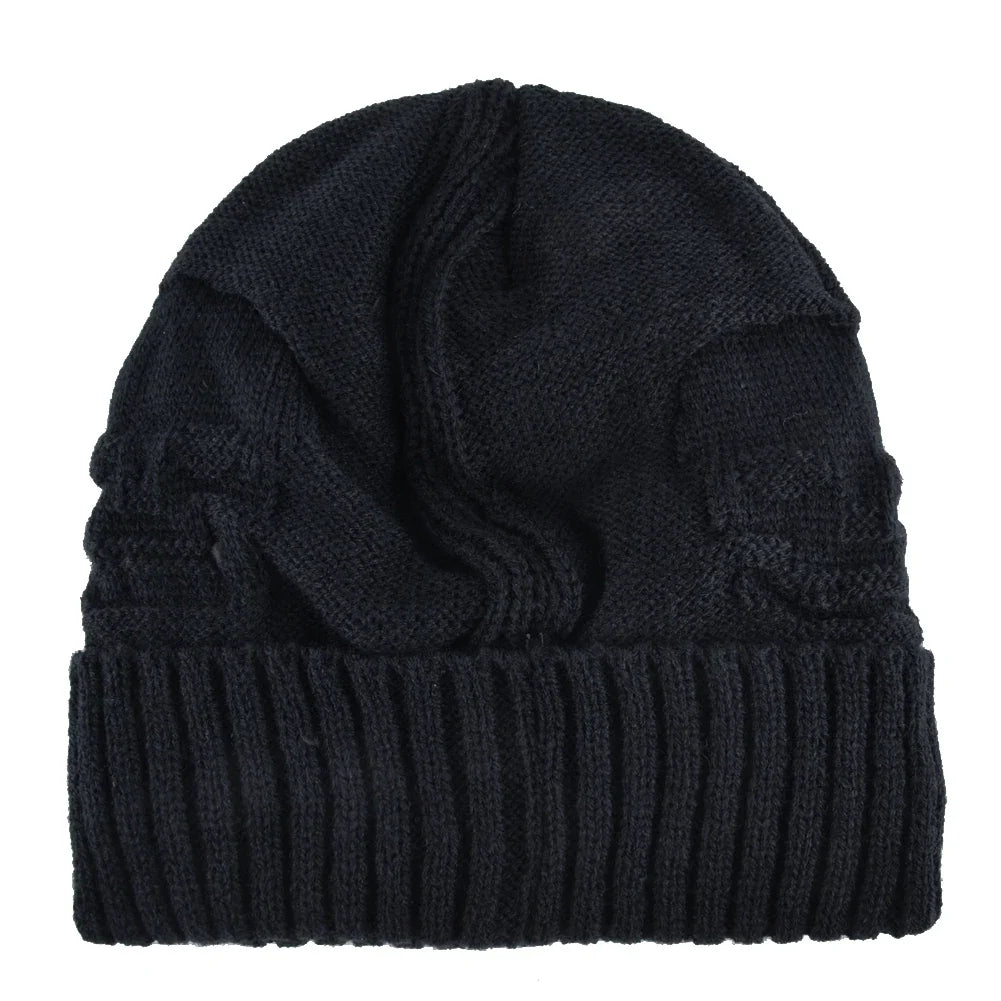 Versatile men's warm knit skull cap beanie with unique metallic accents. Essential winter hat for edgy looks.