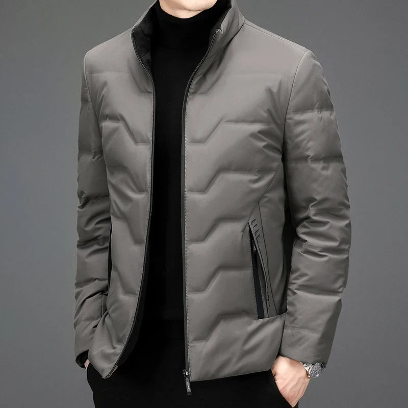 Lightweight men's winter quilted puffer jacket, offering warmth and style for everyday wear. Essential cold weather outerwear.