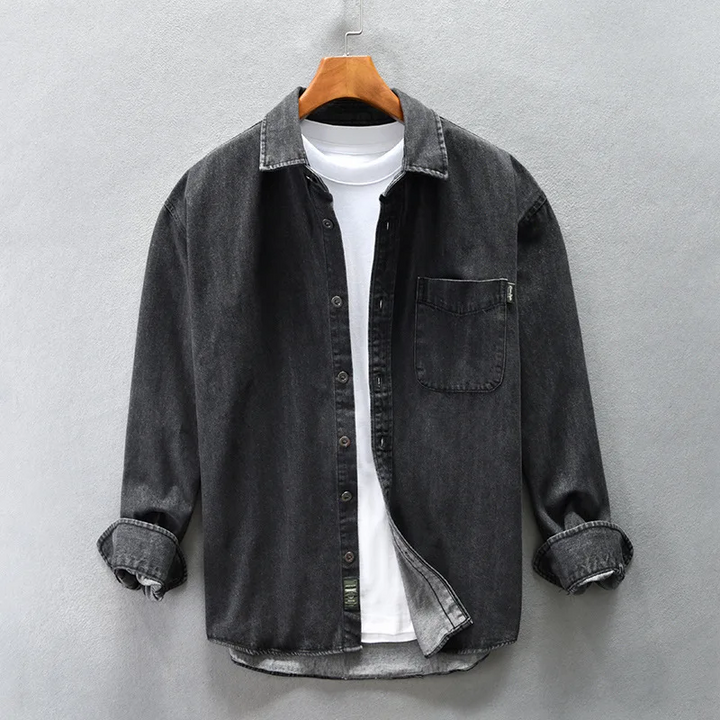 Relaxed fit men's button-up shirt with a chest pocket and long sleeves, offering comfortable casual wear.