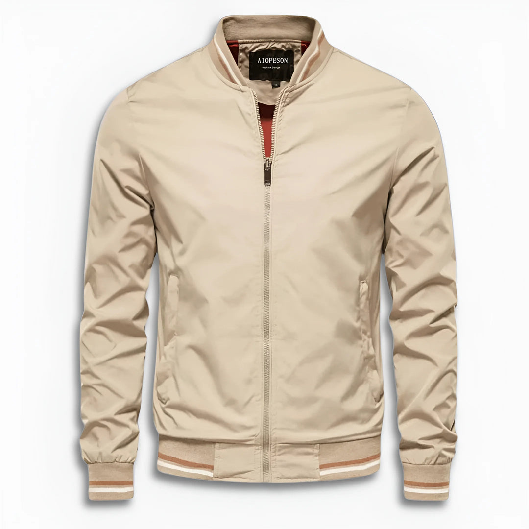 Model wearing a stylish men's water-repellent transition jacket with a stand-up collar, great for fall.