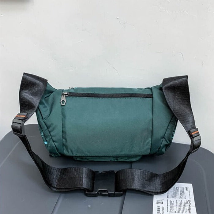 Lightweight men's water-resistant sling pack, perfect for keys, phone, wallet.