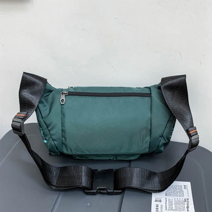 Lightweight men's water-resistant sling pack, perfect for keys, phone, wallet.