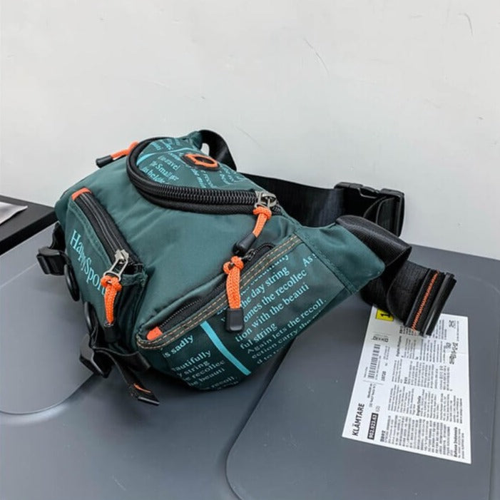 Front view of a men's water-resistant travel bag, worn as a waist pack.