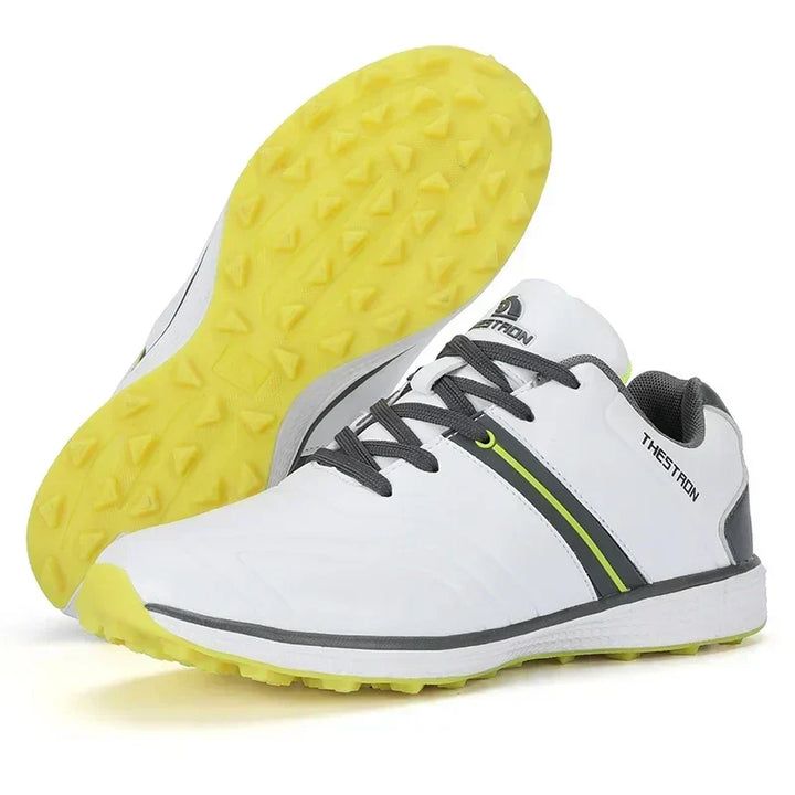 Side view of stylish men's waterproof golf shoes, showcasing athletic design and superior spike outsole.