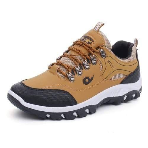 Close-up of men's waterproof hiking and trekking shoes, showing textured sole and sturdy construction