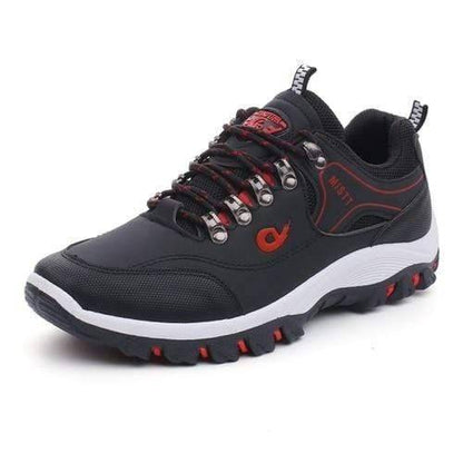 Pair of men's waterproof hiking shoes, dark grey, side view, ready for outdoor and casual wear