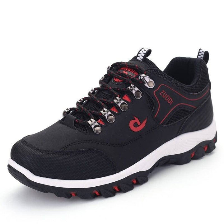 Pair of men's casual waterproof hiking shoes in an outdoor setting, ready for adventure