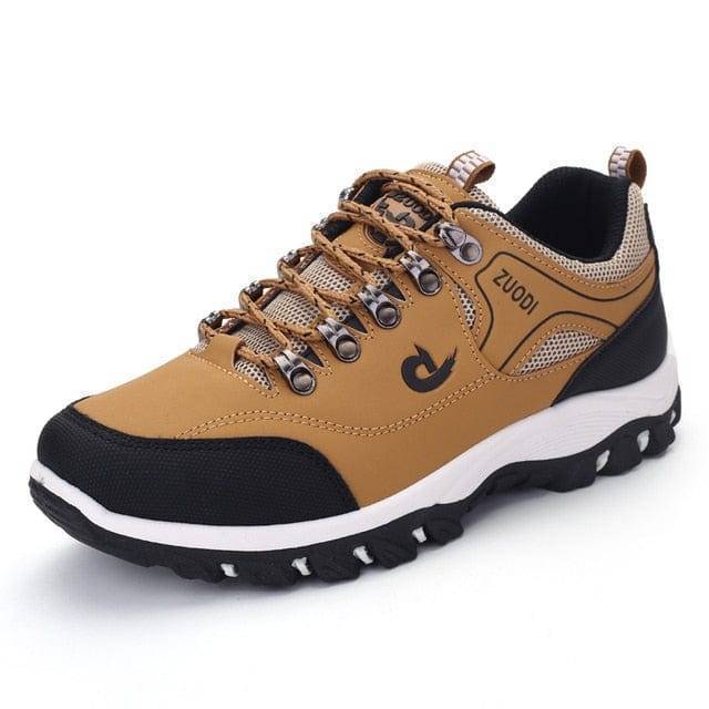 Bottom sole of men's outdoor hiking shoes, showing aggressive grip for traction on varied terrain