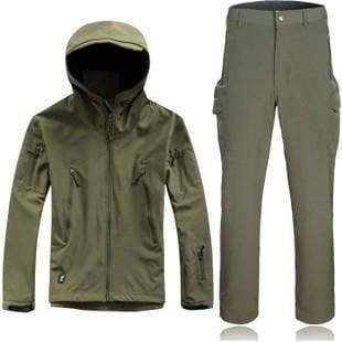 Complete men's waterproof outdoor apparel: tactical hunting jacket and pants set in forest