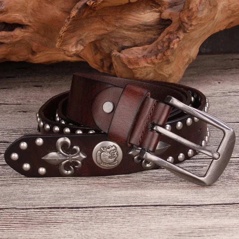 Rugged brown men's western belt featuring decorative studs & a prominent Fleur-de-Lis statement buckle.