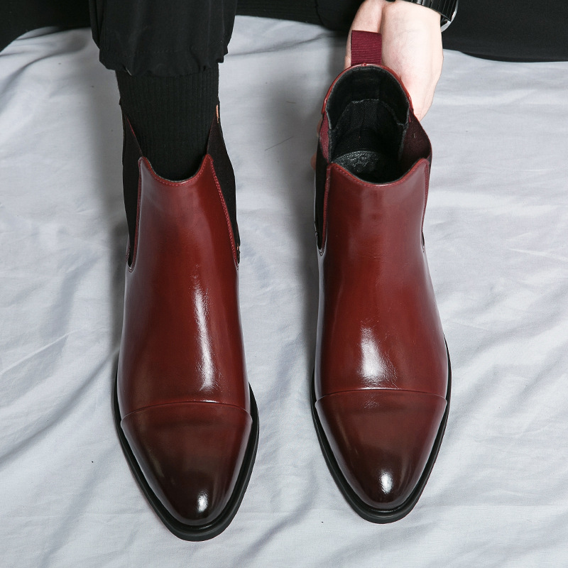 Stylish men's brown Chelsea boots, versatile for dress or everyday wear.