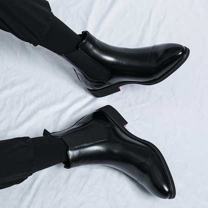 Durable men's black Chelsea boots, ideal for smart casual or formal looks.