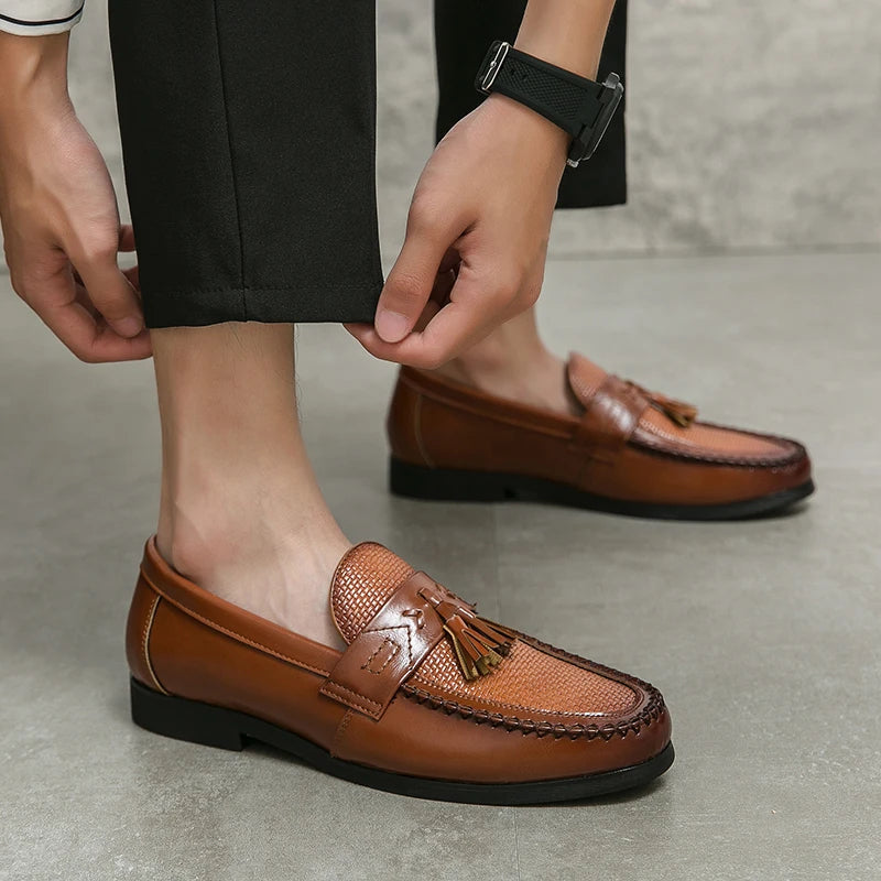 Detailed shot of men's woven tassel loafers, highlighting craftsmanship and classic design.