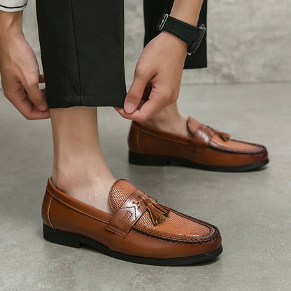 Detailed shot of men's woven tassel loafers, highlighting craftsmanship and classic design.