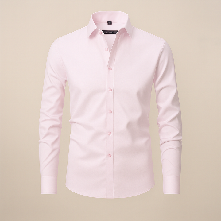 Professional man wearing wrinkle-free long-sleeve button-up shirt, standing pose.
