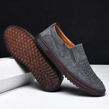 Hand-stitched mens loafers, perforated for breathability, enhancing foot comfort & style.