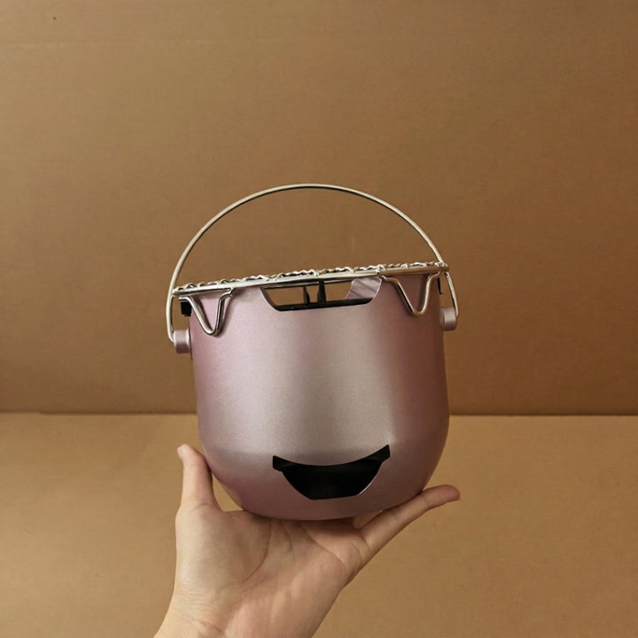 Mini cast iron charcoal camping grill, durable and compact for efficient outdoor cooking.