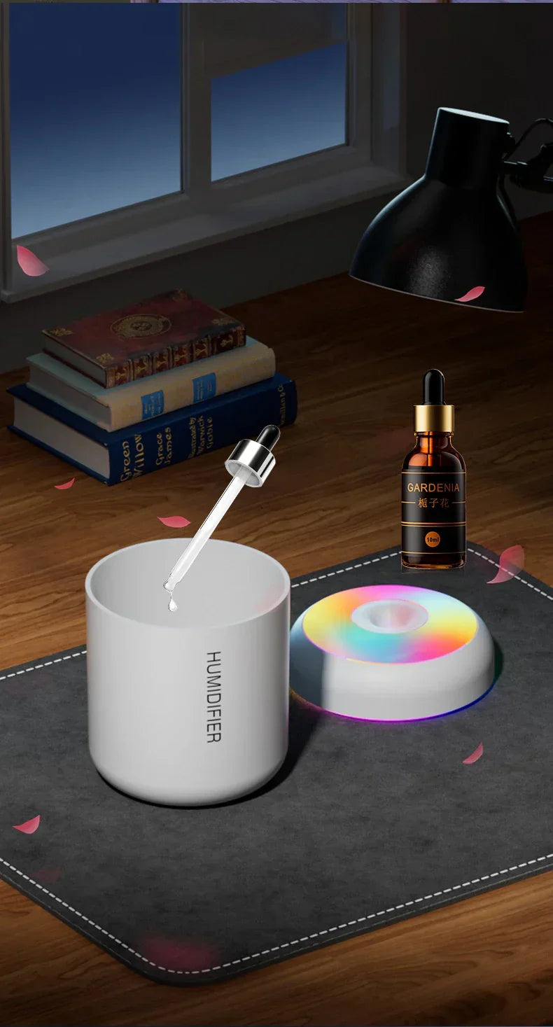 Mini USB essential oil diffuser emitting fine mist. Enhances air quality & aroma in home or office.