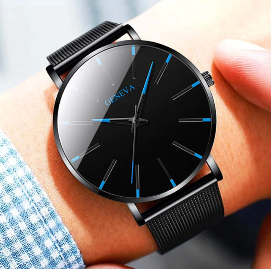 Minimalist men's watch with elegant blue dial accents and a sleek black leather strap, perfect for everyday sophistication.