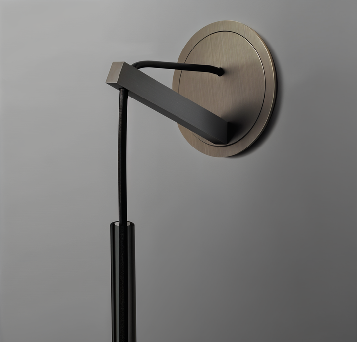 Space-saving Orvane minimalist wall lamp, smoke glass & metal, ideal for hallways, adding elegant ambient light.