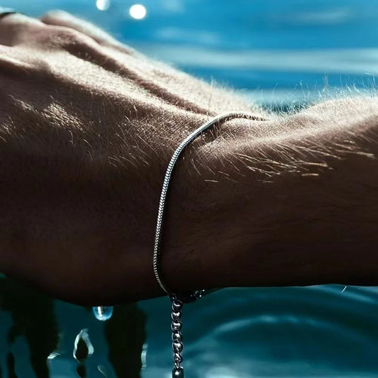 Minimalist stainless steel chain bracelet, perfect unisex everyday wear for modern men & women.