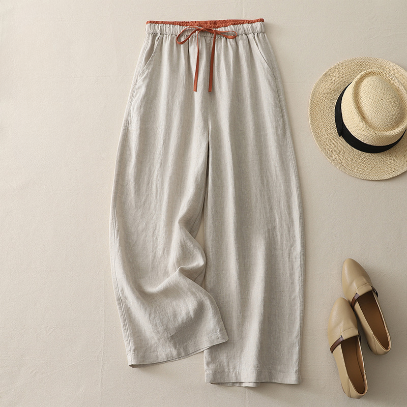 Model wearing women's flowy wide-leg casual pants, perfect for comfortable summer style or a relaxed vacation outfit.