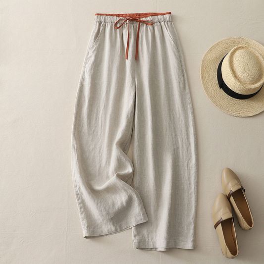 Model wearing women's flowy wide-leg casual pants, perfect for comfortable summer style or a relaxed vacation outfit.