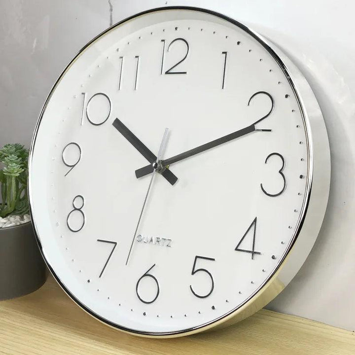 Stylish 12-inch non-ticking wall clock with quartz accuracy, ideal for a modern office environment.