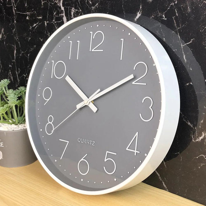 Minimalist 12-inch non-ticking wall clock with quartz movement, perfect for quiet bedrooms.