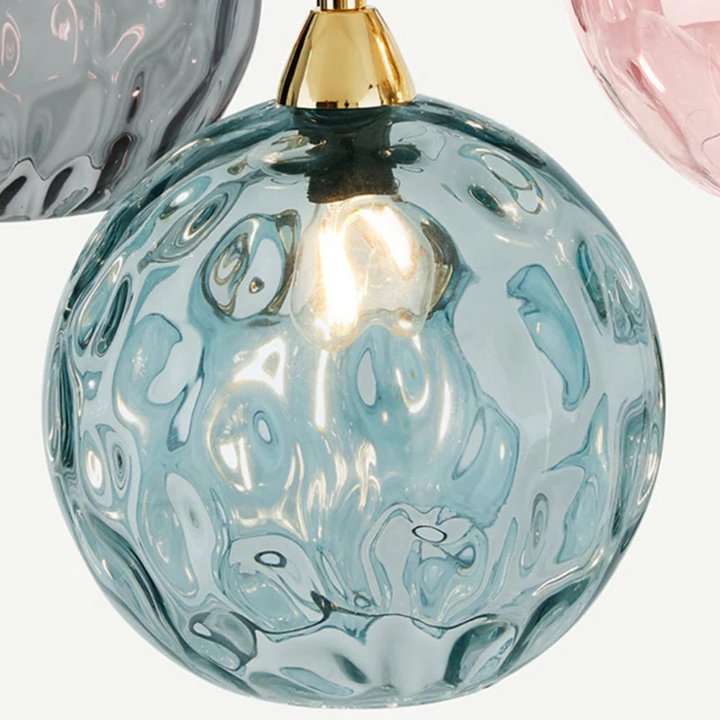 Modern cascade ceiling light with three lamps, perfect for upscale home decor.