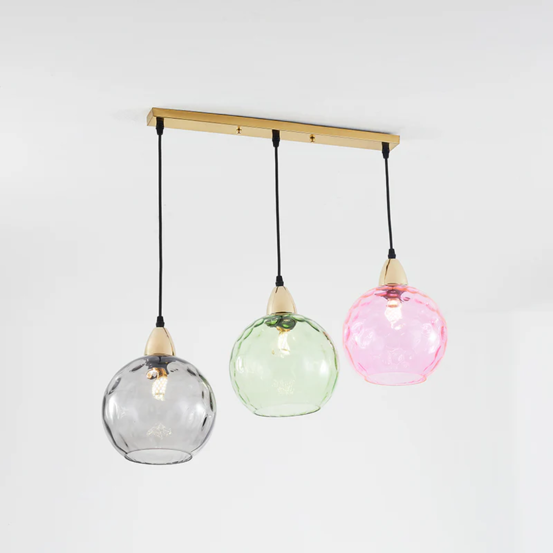 Sleek modern cluster pendant light with three adjustable lamps, ideal home decor.