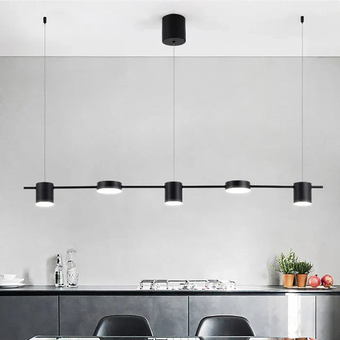 Stylish gold AuraDrum LED pendant light for contemporary dining rooms.