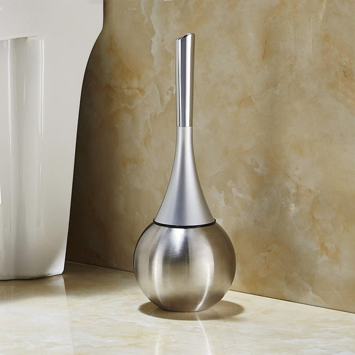 Elegant gold finish toilet brush with flexible silicone cleaning head; a durable modern bathroom accessory.
