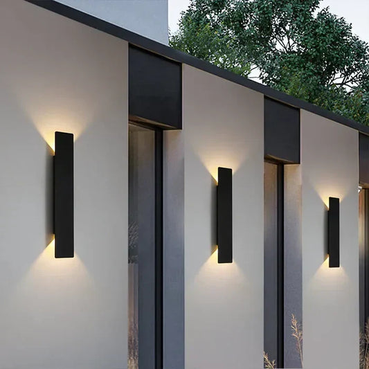 Modern black aluminum outdoor wall lamp, weatherproof, with warm white LED for garden or patio. Energy efficient.