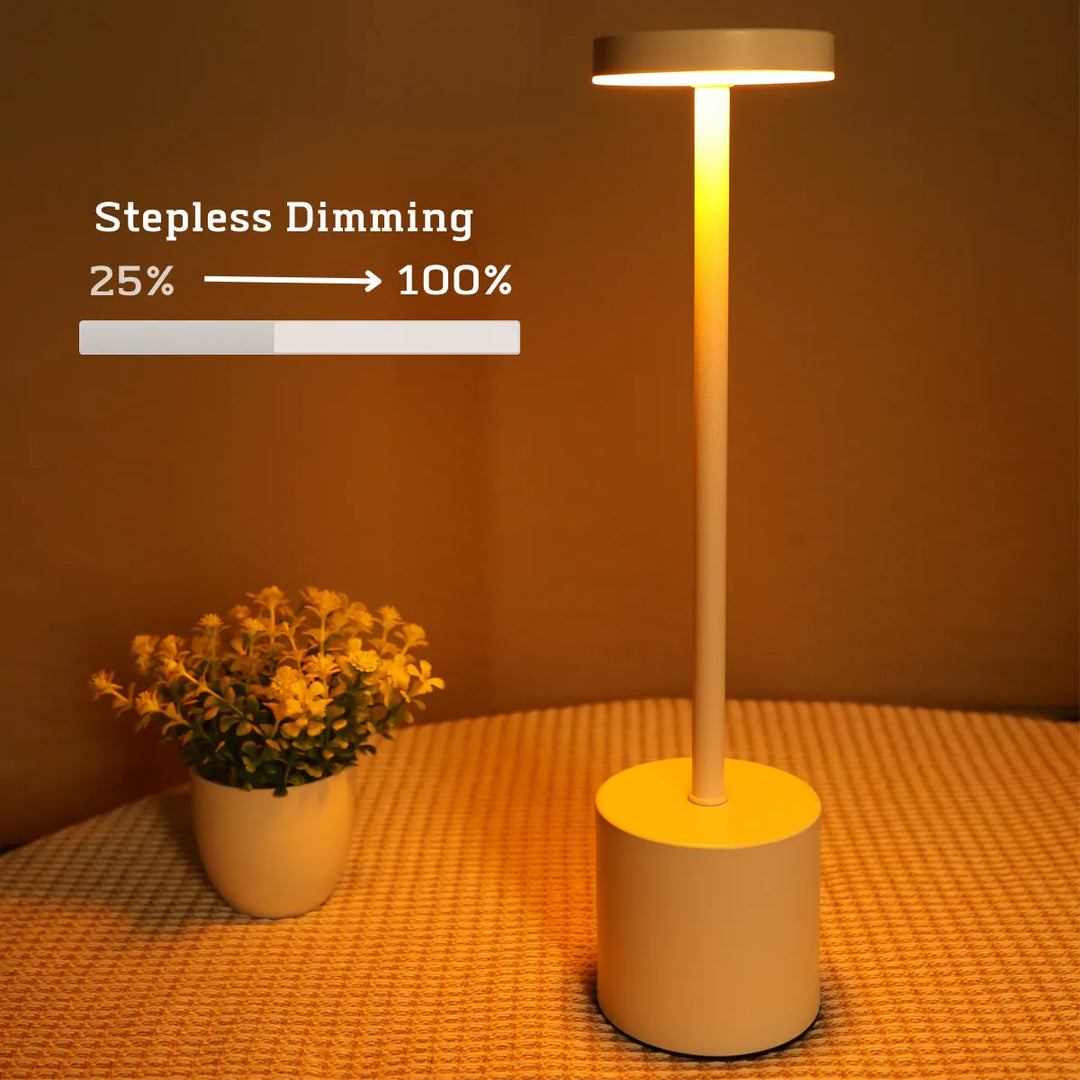 Sleek white wireless LED table lamp. Dimmable touch control, ideal for bedroom, office, or outdoor ambient lighting.