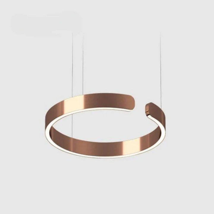 Contemporary gold circular LED pendant light. HaloRing design enhances modern dining rooms and elegant living areas.