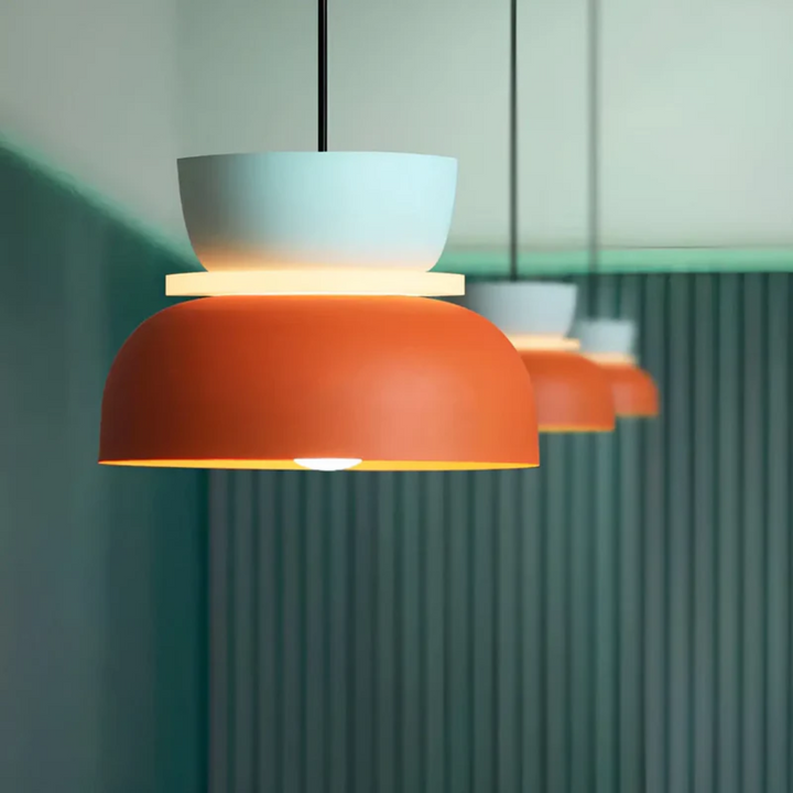 Simple, modern Macaron LED pendant light in a vibrant color, energy-efficient home lighting.