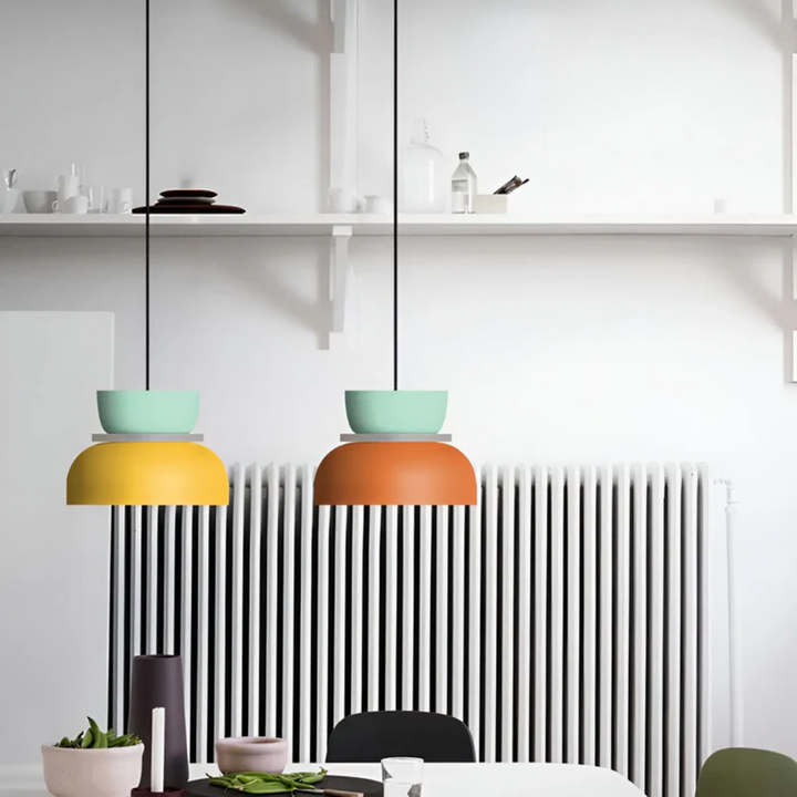 Colorful Macaron LED pendant light enhancing a dining area, modern and inviting lighting fixture.