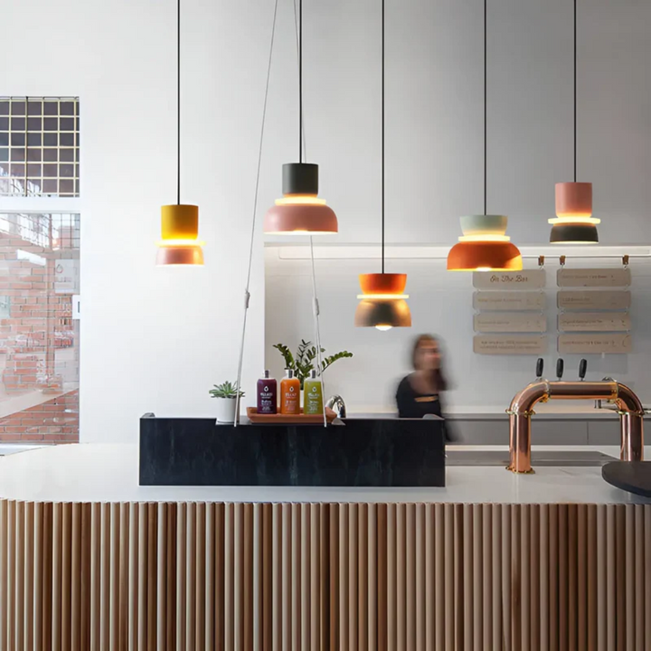 Unique Macaron LED pendant light, modern colorful fixture for distinctive interior design.