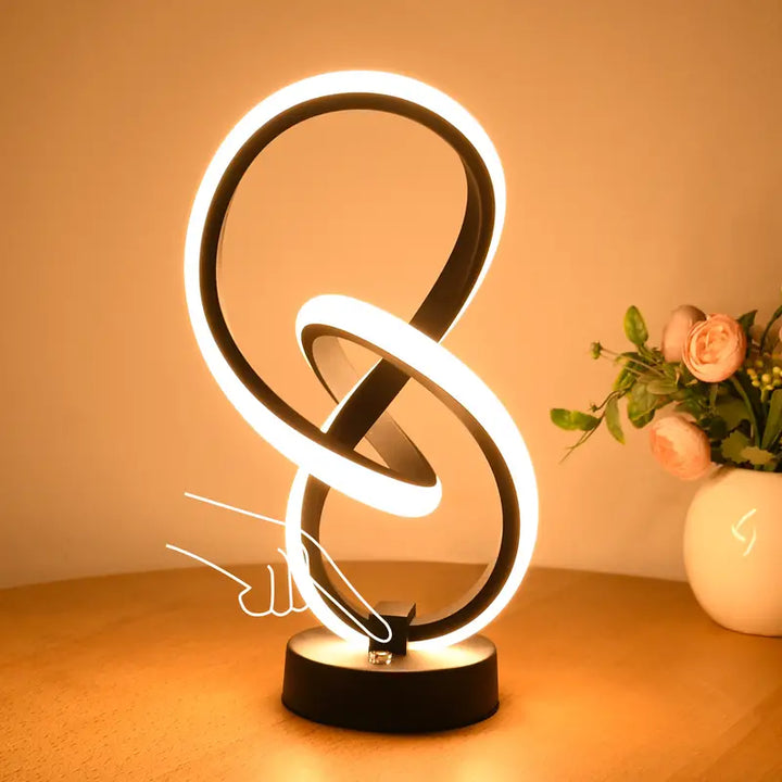 Modern dimmable Elara desk lamp for home or office, featuring adjustable light and sleek minimalist design.