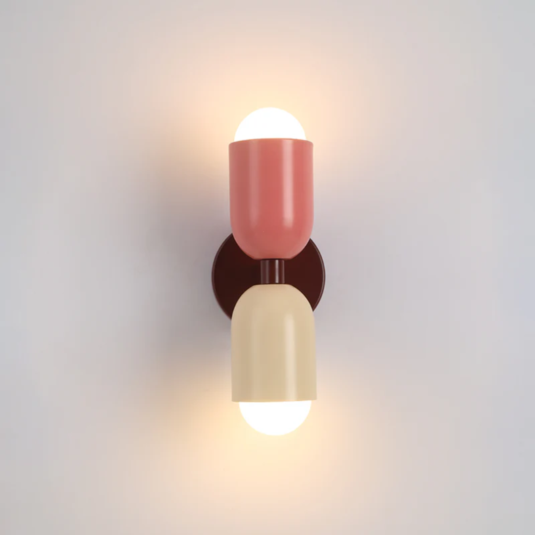 Elegant Colorwave LED wall lamp, providing warm white, double-sided illumination for bedrooms.