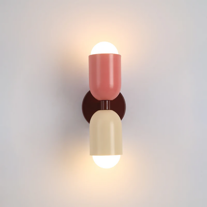 Elegant Colorwave LED wall lamp, providing warm white, double-sided illumination for bedrooms.